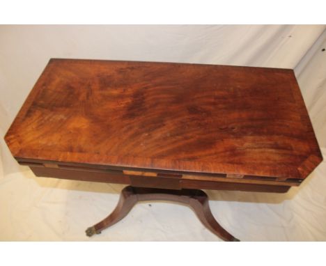 A 19th century figured mahogany and cross-banded rectangular turn-over top card table with baize lined playing surface on rec