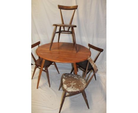 A 1960's Ercol pale elm circular dining table 35½" diameter (af) together with a set of four Ercol angular stained light elm 