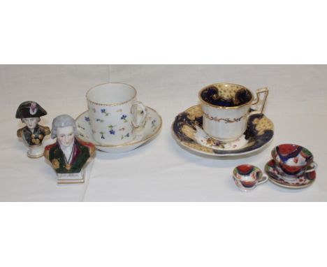 Two 19th century  tea cups and saucers with floral decoration, a miniature Naples bust of Nelson and other china