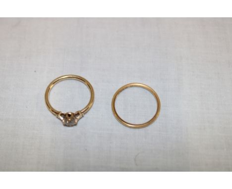 A 22ct gold wedding band (1.9g) and a gold dress ring set cubic zircona (1.1g)