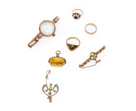 A collection of jewellery  to include a 9ct gold tigers eye set ring, a 9ct gold garnet and pearl set cluster ring; a peridot