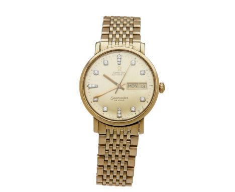 OMEGA - A gentleman's diamond set wristwatch  Seamaster, De Ville, the round champagne dial with diamond indicators, sweep se