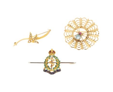 Three gem set brooches  the first modelled as a spider in its web, the body set with a small round cut zircon and ruby, stamp