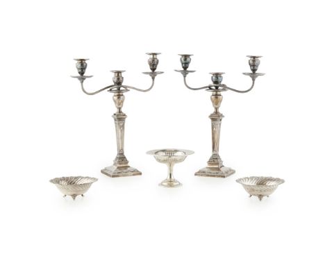 A pair of three light table candelabra  London 1883, the square base with garland motifs and gadroon rims, tapered column, th