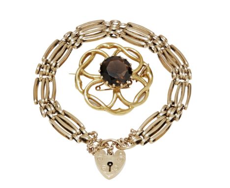 A 9ct gold gate link bracelet  of traditional form with padlock clasp and safety chain; together with a 9ct gold smokey quart