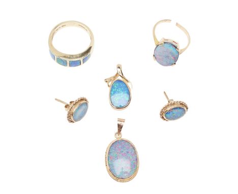 A collection of opal jewellery  to include an opal doublet set ring, a contemporary 9ct gold opal set ring, a 9ct gold opal s