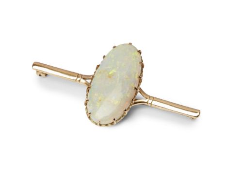 A large opal set bar brooch  claw set with a large oval opal, to a plain bar brooch, stamped 9ct  Length: 62mm