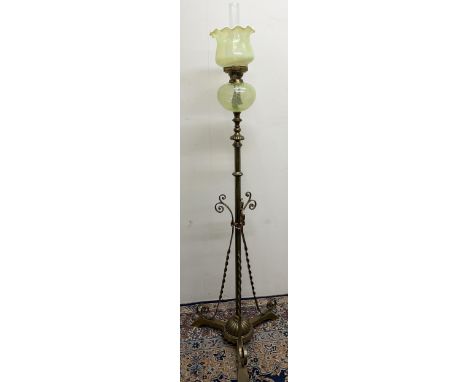 Arts and Crafts brass floor standing oil lamp, in the manner of W.A.S. Benson, adjustable column with scroll and spiral twist