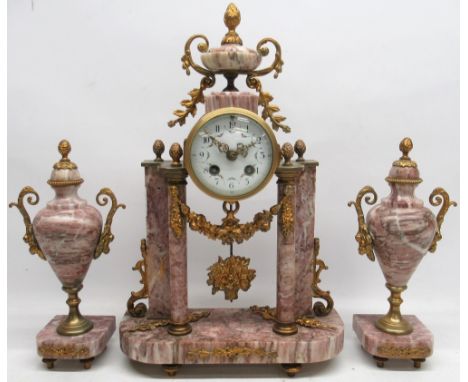 Late 19th century pink marble three piece clock garniture, portico clock with convex painted Arabic dial with urn cresting, t