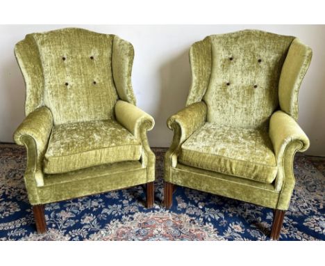 Pair of George 111 style wing back arm chairs, serpentine shaped button backs and scroll arms on moulded square supports with