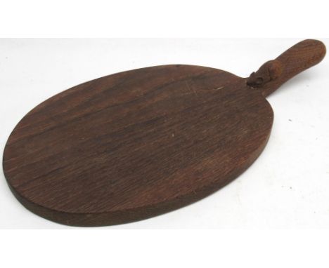 Robert Mouseman Thompson of Kilburn - an oak oval cheese board, curved handle carved with signature mouse, L39cm 