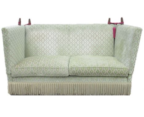 Knole type upholstered sofa, with two drop down arms, loose seat cushions and fringed frieze, W330cm D100cm H120cm max 