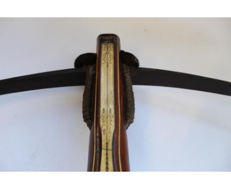 17th century continental, possibly German, crossbow with 62cm steel bow, walnut frame inset with carved bone panels and hair 