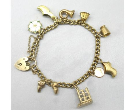 9ct yellow gold charm bracelet with heart padlock closure, set with nine 9ct yellow gold charms including an enamel Yorkshire