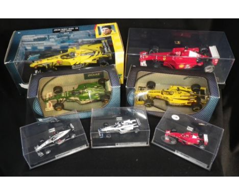 'HOT WHEELS' BY MATTEL: A FERRARI F1 'MICHAEL SCHUMACHER' RACING CAR, in perspex display box, 'A Jordan Mugen Honda 199 racin