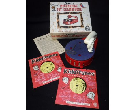 LOUIS MARX & CO LTD: A VINTAGE 1950S 'Lumar' mechanical toy gramophone, with red plastic body, complete with instructions and