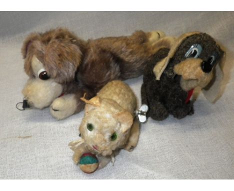 MERRYTHOUGHT: A VINTAGE PLUSH DOG, a Vintage tin plate clockwork plush covered cat and a similar dog  (3) Condition:  both cl