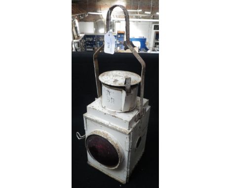 A VINTAGE 'B.R.' RAILWAY LAMP IN CREAM with red lenses, burner intact Condition:  in original condition, some older surface r