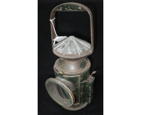 A VINTAGE GREEN RAILWAY MAN'S LAMP with a label inscribed 'WAKEFIELDS 1945 BIRMINGHAM' burner intact Condition:  in original 
