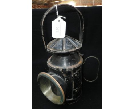 A VINTAGE 'B.R.'  'S.R.' RAILWAY MAN'S LAMP with revolving 'Red' lens, with original black japanned paint work. Burner intact