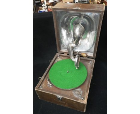 A VINTAGE 'DECCA JUNIOR' PICNIC GRAMOPHONE in a leather effect case Condition:  it is running¦appears complete¦the case is qu