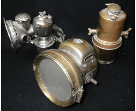 A VETERAN MOTOR CYCLE CARBIDE HEADLAMP in brass, a motor cycle carbide canister and a Lucas  carbide bicycle lamp Condition: 