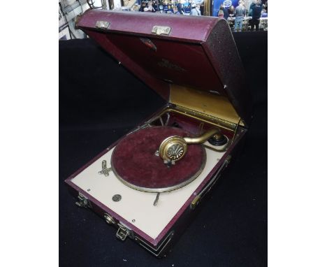 A VINTAGE 1930S 'DECCA 20' PORTABLE GRAMOPHONE in a red case Condition:  looks to be in good original condition,¦have had it 