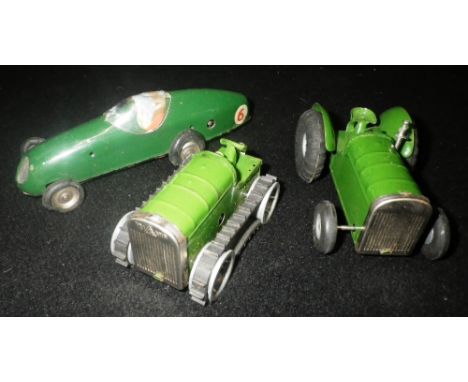 MINIC TOYS: A TIN-PLATE TRACTOR, a 'Caterpillar' tractor and a green racing car (3) Condition:  all have been wrapped in pape