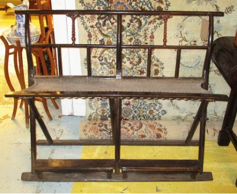 CHINESE FOLDING SCRIBES BENCH, with woven seat and red painted turned detail to backrail, 42cm x 106cm H x 130cm.