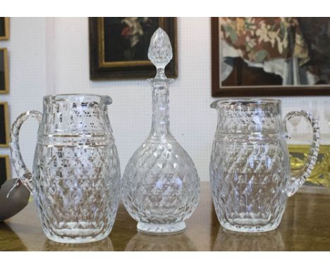 BACCARAT GLASSWARES, comprising a decanter, plus a pair of water jugs, all with diamond cut decoration. (3)