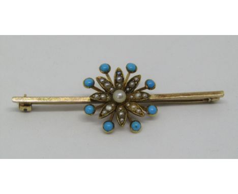 A yellow metal bar brooch with turquoise and seed pearl set floral motif, 5.8cm long approx, 5.1g