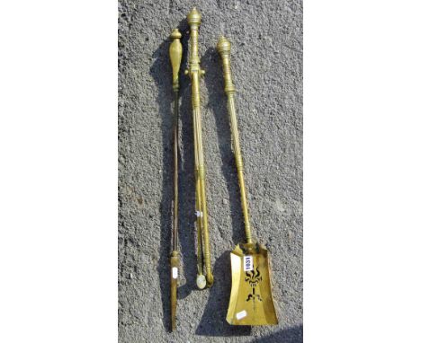 Two late Victorian brass fire irons with partially reeded handles, the shovel with pierced detail and diamond registration ma