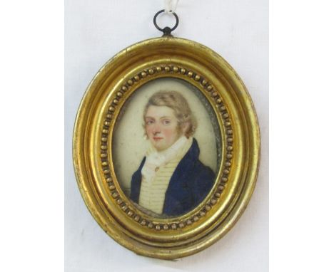 Early 19th century miniature bust length portrait of oval form showing a gentleman in blue coat and white cravat, watercolour