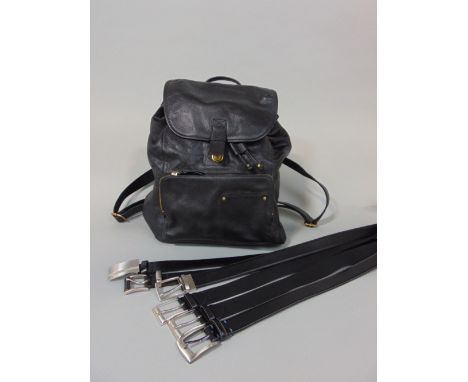 Black Fossil leather backpack with a collection of black men's belts including one by Hugo Boss 