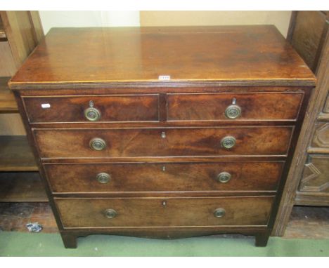 A small Regency mahogany chest of three long and two short graduated drawers with brass ring handles, raised on bracket suppo