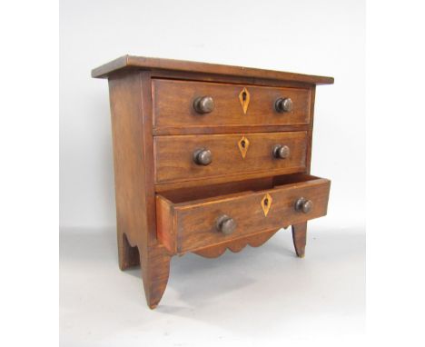 Apprentice Furniture - Mahogany chest of three long drawers with wavy apron and bracket feet, 30cm wide