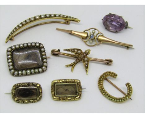 A good collection of antique brooches to include a graduated seed pearl example of crescent form, a cannetille letter 'C' bro