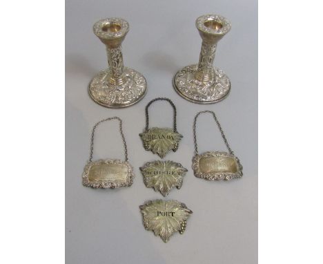 A mixed collection of silver to include two Victorian style embossed candlesticks, maker B &amp; C, Birmingham 1974, 11 cm hi