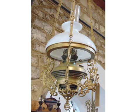 Good quality 19th century hanging oil lamp, with pierced scrolled bracket frame and opaline shade, over 100cm high