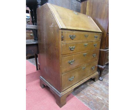 A small Georgian oak countrymade bureau, the front elevation enclosed by four long graduated drawers (one dummy) the fall fla