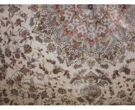 Woven silk carpet, with scrolled floral decoration upon an ivory ground, 310 x 200 cm 