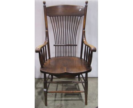 A late 19th/early 20th century American ashwood armchair with turned frame, saddle shaped seat and waisted turned comb splat 