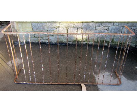 An old ironwork fireguard with simple open vertical rails, 157 cm wide x 33 cm deep x 78 cm high
