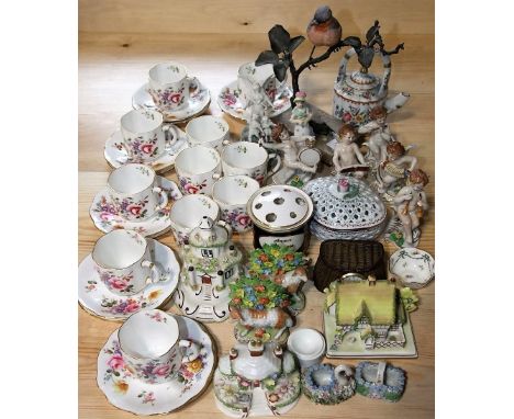 A collection of Royal Crown Derby Posies pattern tea wares comprising eleven cups and twelve saucers, together with a pair of