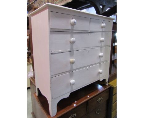 An early 19th century pine bedroom chest of two short over three long graduated drawers with ceramic knob handles and bracket