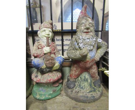 A weathered cast composition stone garden gnome in standing pose, together with a further gnome seated cross legged on a toad