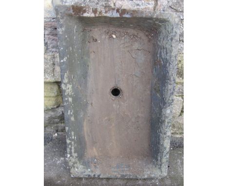 A weathered slate trough of shallow rectangular form 93 cm long x 56 cm wide x 11 cm deep