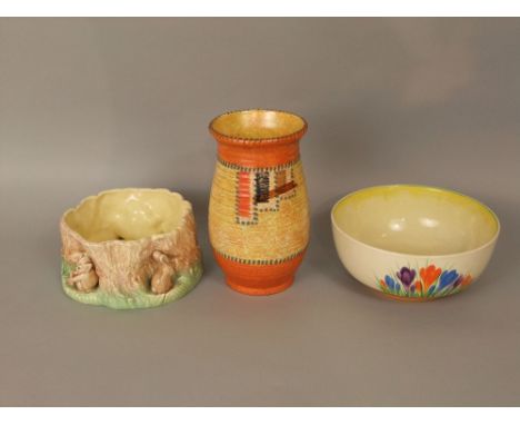 A Clarice Cliff fruit bowl with painted blue orange and purple crocus decoration, printed marks to base and impressed numbers