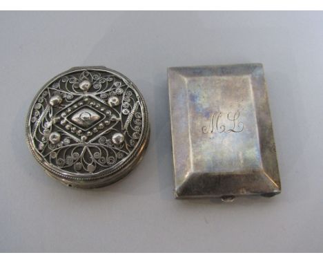 Interesting white metal filigree hinged box with engine turned decoration to the base, 6 cm diameter; together with a further