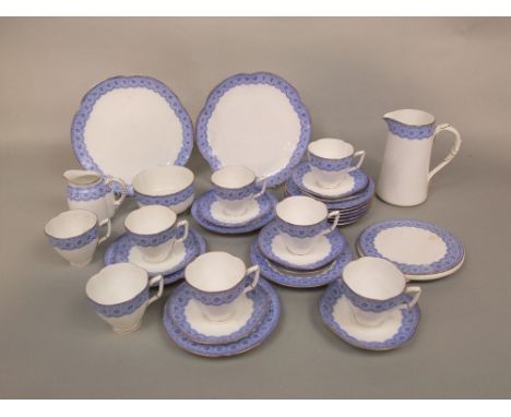 A collection of late 19th century Royal Worcester tea wares with blue printed simulated lace border decoration comprising mil